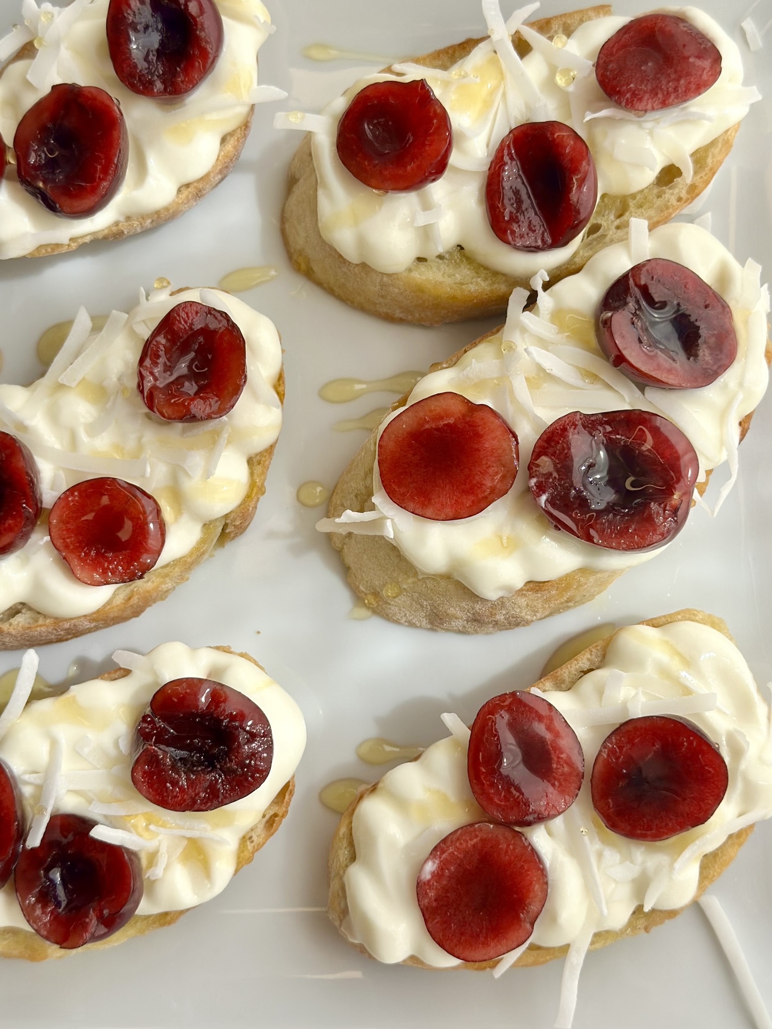 Whipped Goat Cheese Crostini with Fresh Cherries and Coconut Flakes: The Summer Appetizer Recipe You’ll Make All Season
