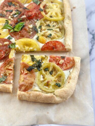 Heirloom tomato puff pastry tart served